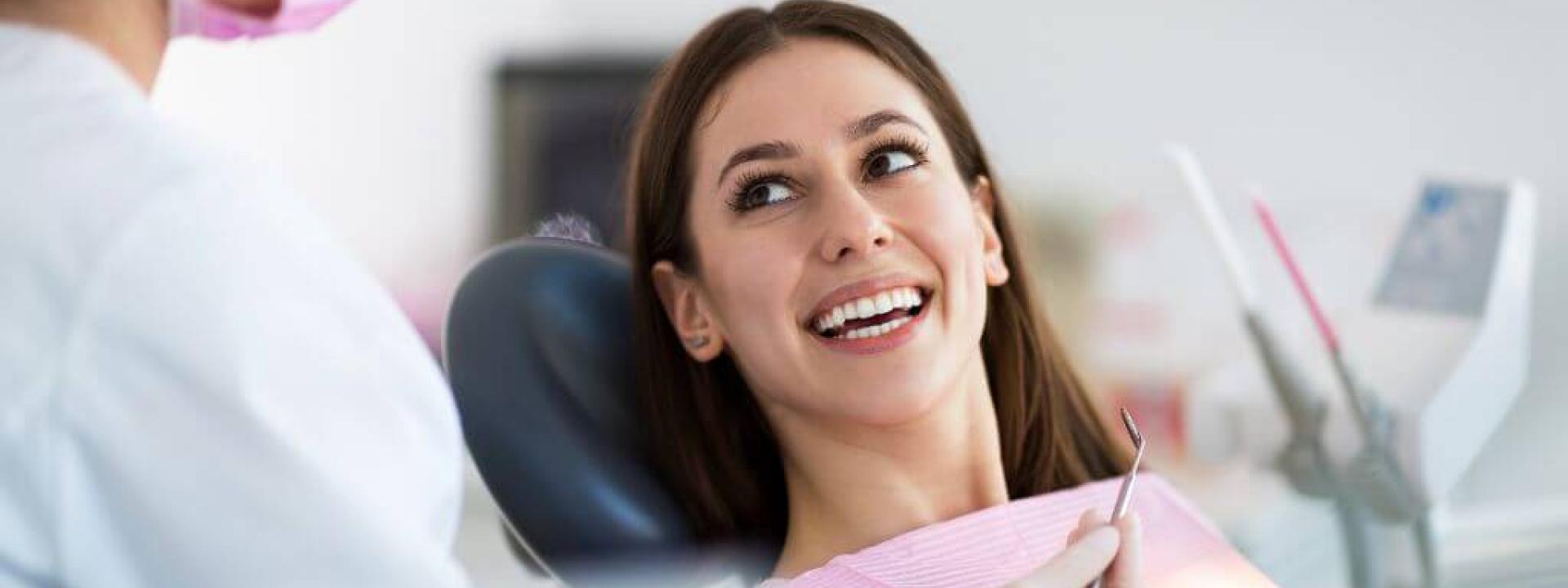 Woman in dental chair smiling